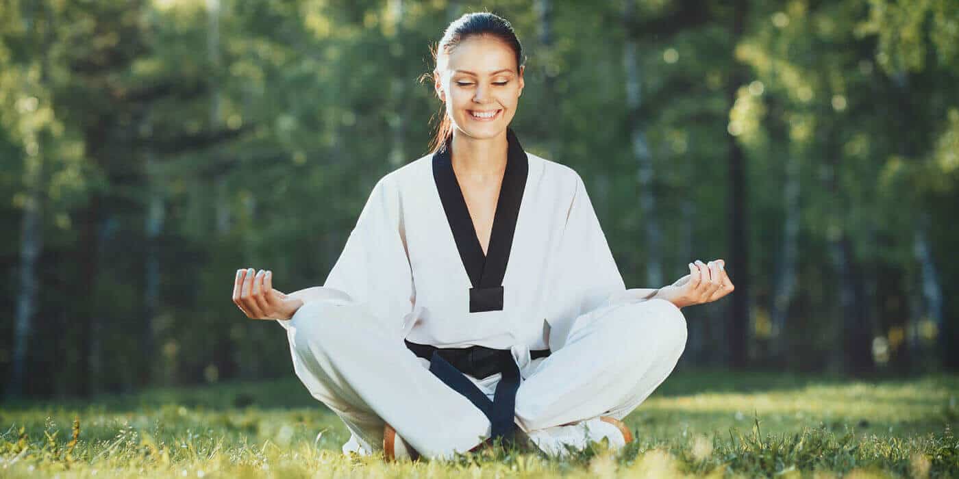 Martial Arts Lessons for Adults in Hillsborough NJ - Happy Woman Meditated Sitting Background